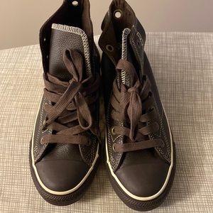 Brown leather converse